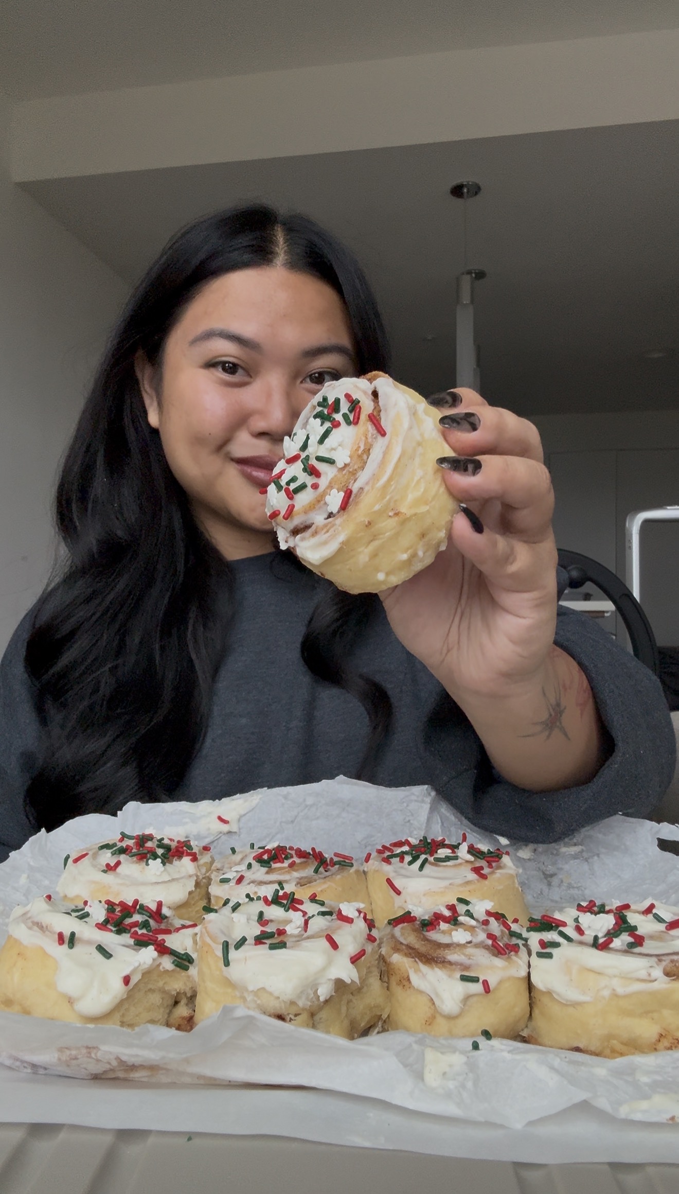 Holding holiday cinnamon rolls